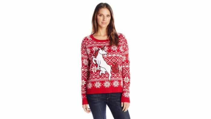 woman wearing a Christmas sweater on a pair of jeans