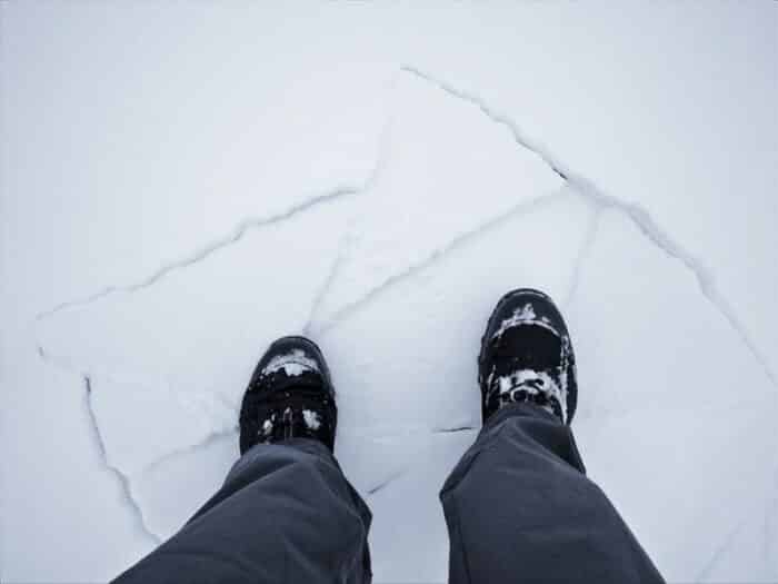 picture of a foot on cracked snow